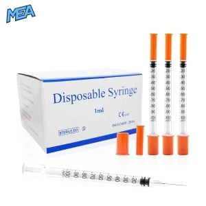 1ml insulin syringe with fixed needle and orange caps beside the disposable syringe box