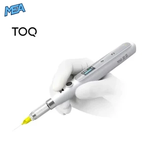 Dentist holding the TOQ III wireless dental anesthesia injector with needle attached for a painless local injection